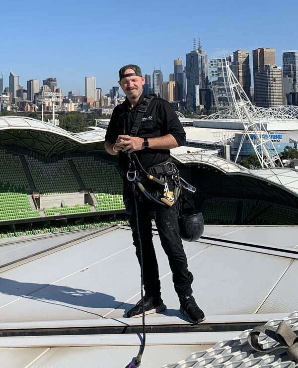 Dan Booth, Director of Operations at Mission Possible, on a rope access job at AAMI Park, Melbourne